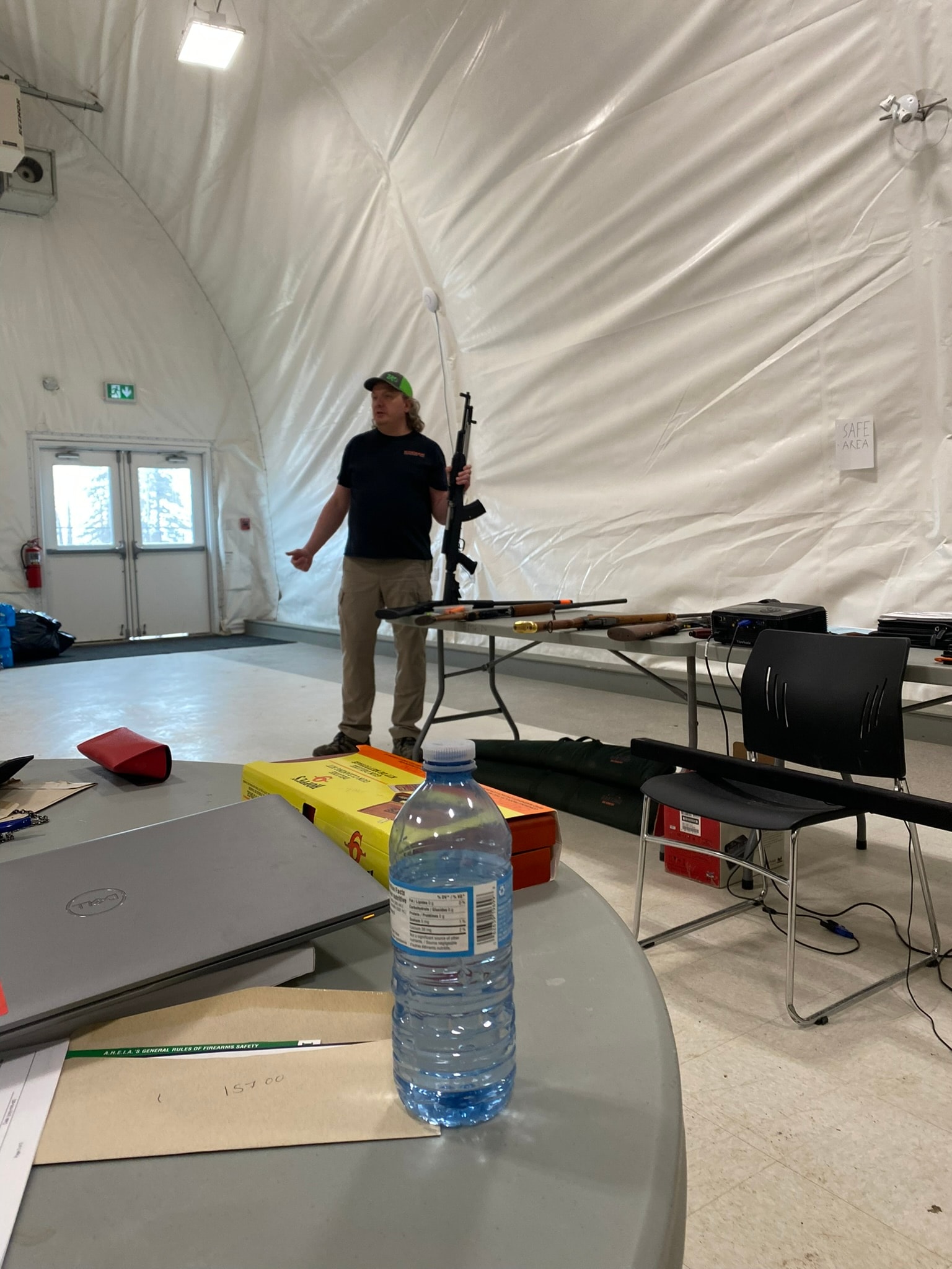 CFSC course classroom setup with firearms on display table